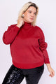 Modelo Victoria veste blusa tricot orion vermelha no tamanho GG. Peça com fios de lurex. Produzido inteiramente no Brasil.